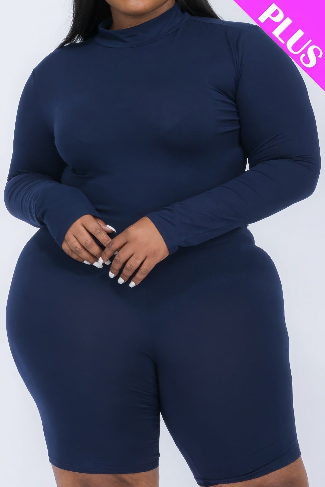 Plus-size mock neck top and biker shorts set in navy, showcasing a stylish and comfortable outfit for curvy women.