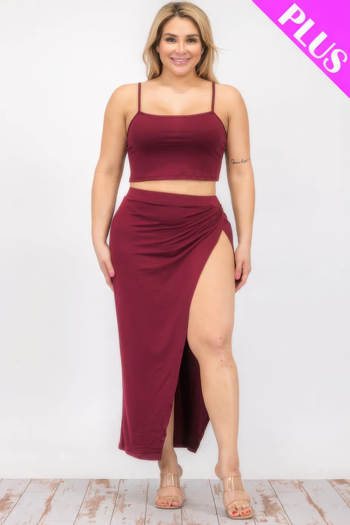 Plus size burgundy crop cami and split thigh maxi skirt set with spaghetti straps, designed for style and comfort.