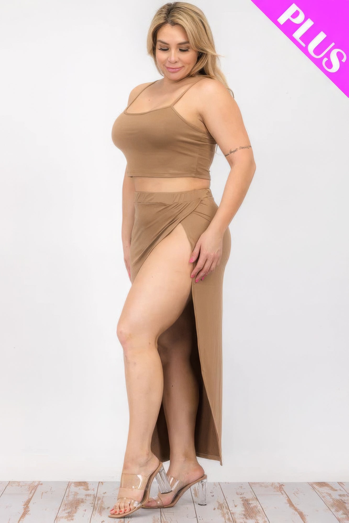 Plus size model wearing a brown crop cami and split thigh maxi skirt set, showcasing style and comfort.