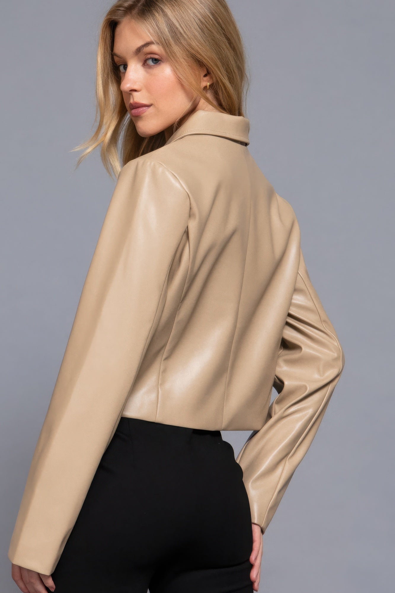 Woman wearing taupe long sleeve shirt collar faux leather jacket by Love It Clothing, showcasing chic and versatile style.