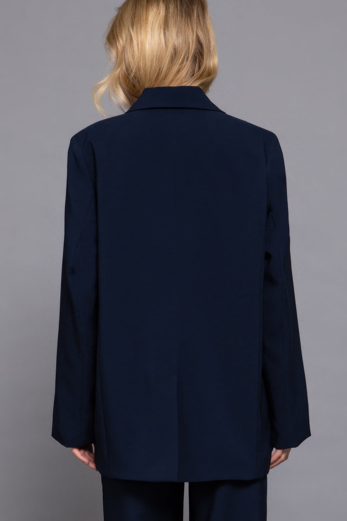 Back view of Long Sleeve Notched Collar Blazer in deep navy color, showcasing its elegant design and tailored fit.
