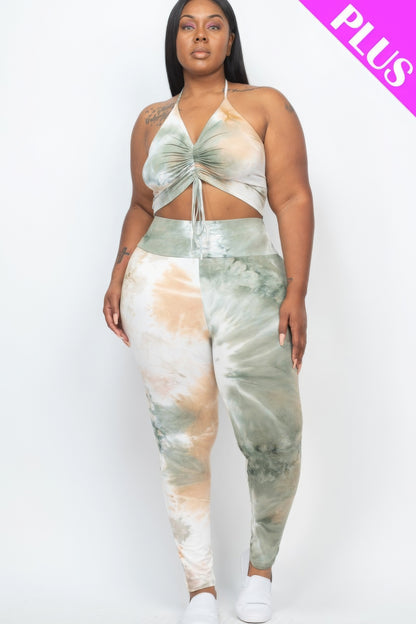 Plus size adjustable ruched crop top and leggings set in high-stretch jersey fabric, featuring a stylish tie-dye pattern.