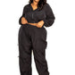 Woman wearing a black active zip-up set with cord lock detail, plus size activewear in extended sizes 1XL to 3XL, comfortable and stylish for workouts.