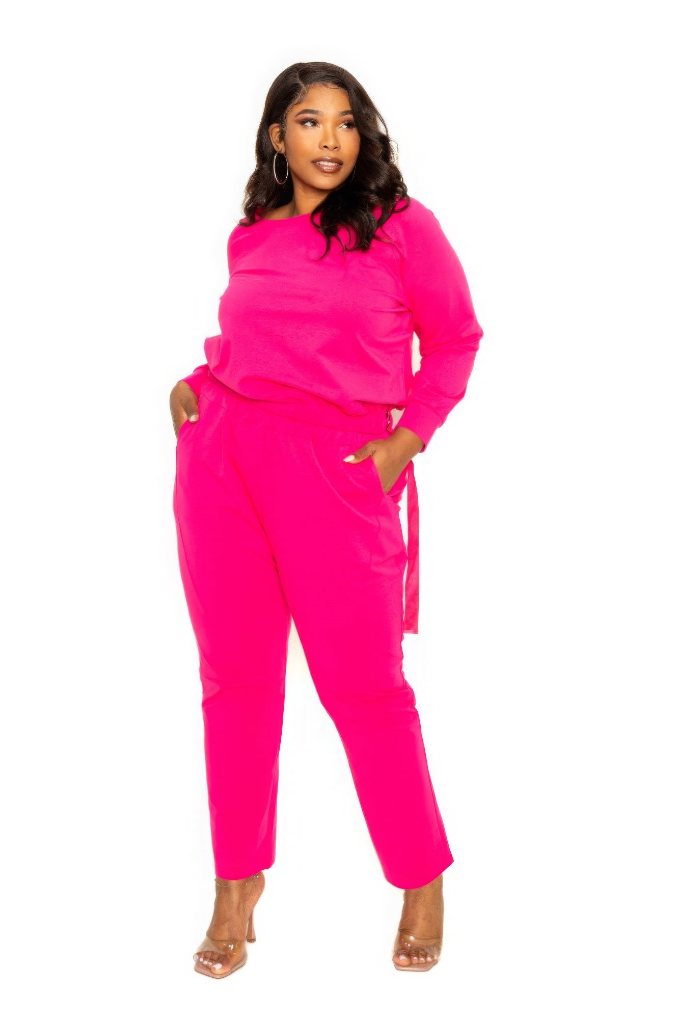 Woman wearing a pink Grommet Detail Lounge Set with pockets, showcasing plus-size fashion in a stylish and comfortable design.