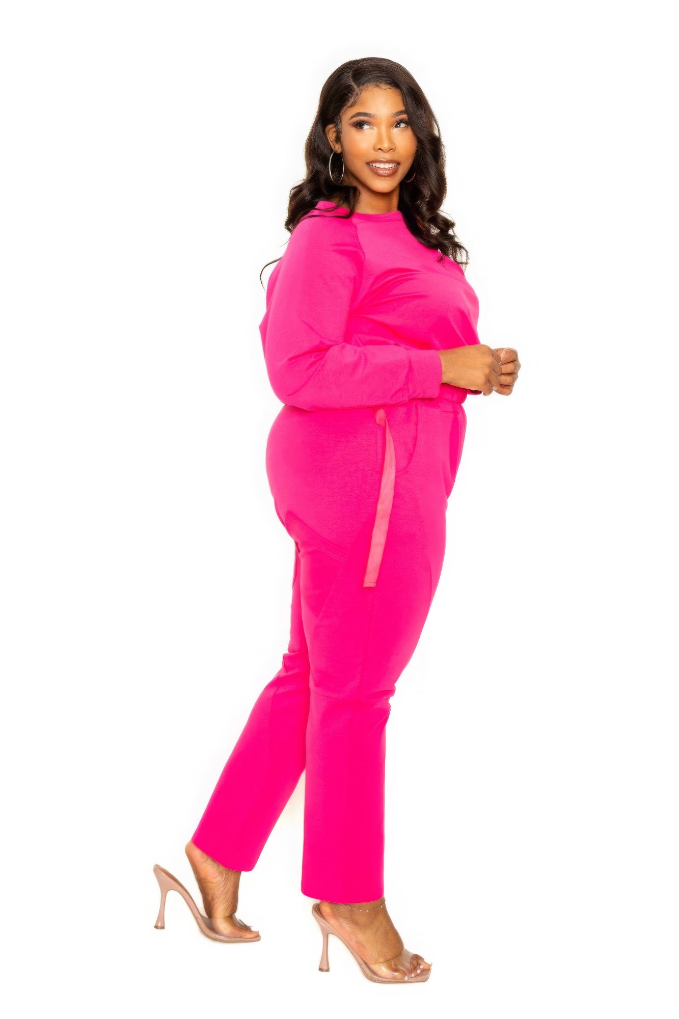 Woman wearing pink Grommet Detail Lounge Set in extended size, showcasing comfortable and stylish fashion for everyday wear.