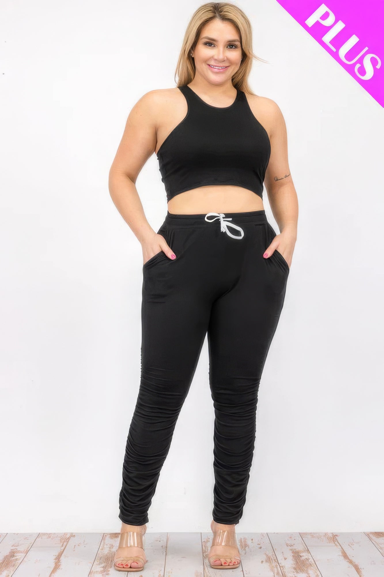 Plus size black crop tank top and ruched pants set with drawstring waist, perfect for stylish comfort.