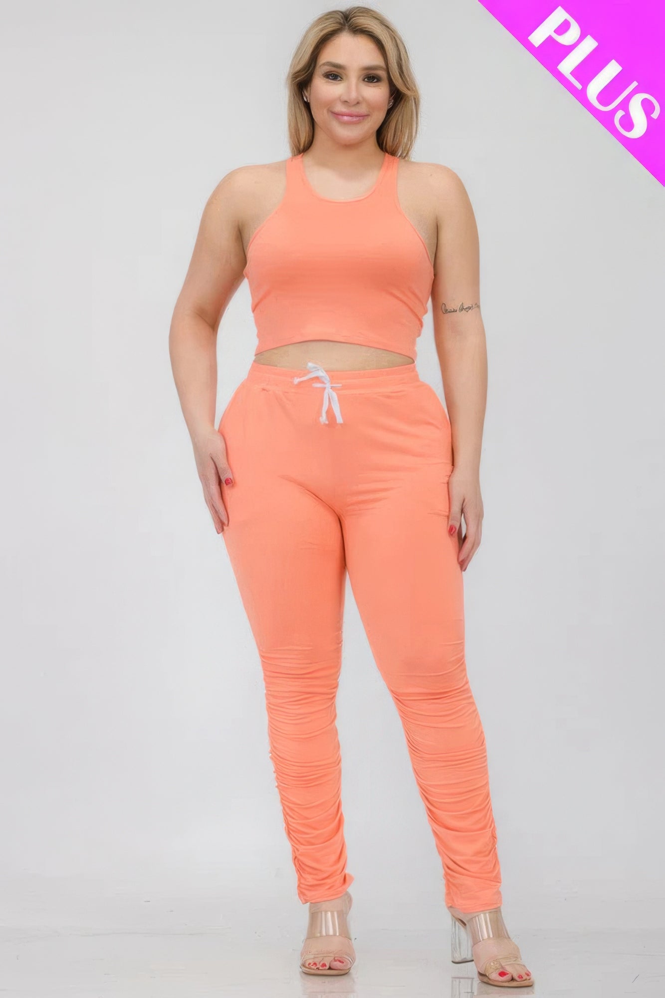 Plus Size Crop Tank Top & Ruched Pants Set in coral, showcasing stretch and comfort with polyester-spandex blend.