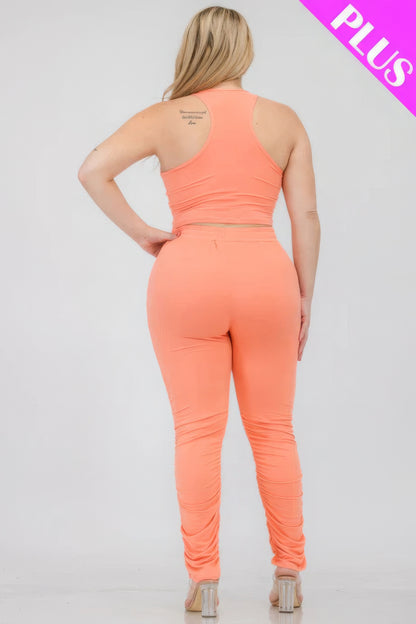 Plus size coral crop tank top and ruched pants set, back view, highlighting stretchy polyester-spandex fabric for comfortable fit.