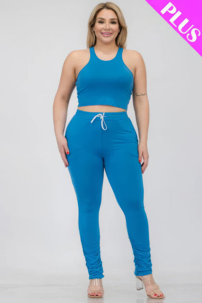 Plus size blue crop tank top and ruched pants set, featuring a comfortable fit and stretch fabric for style and versatility.