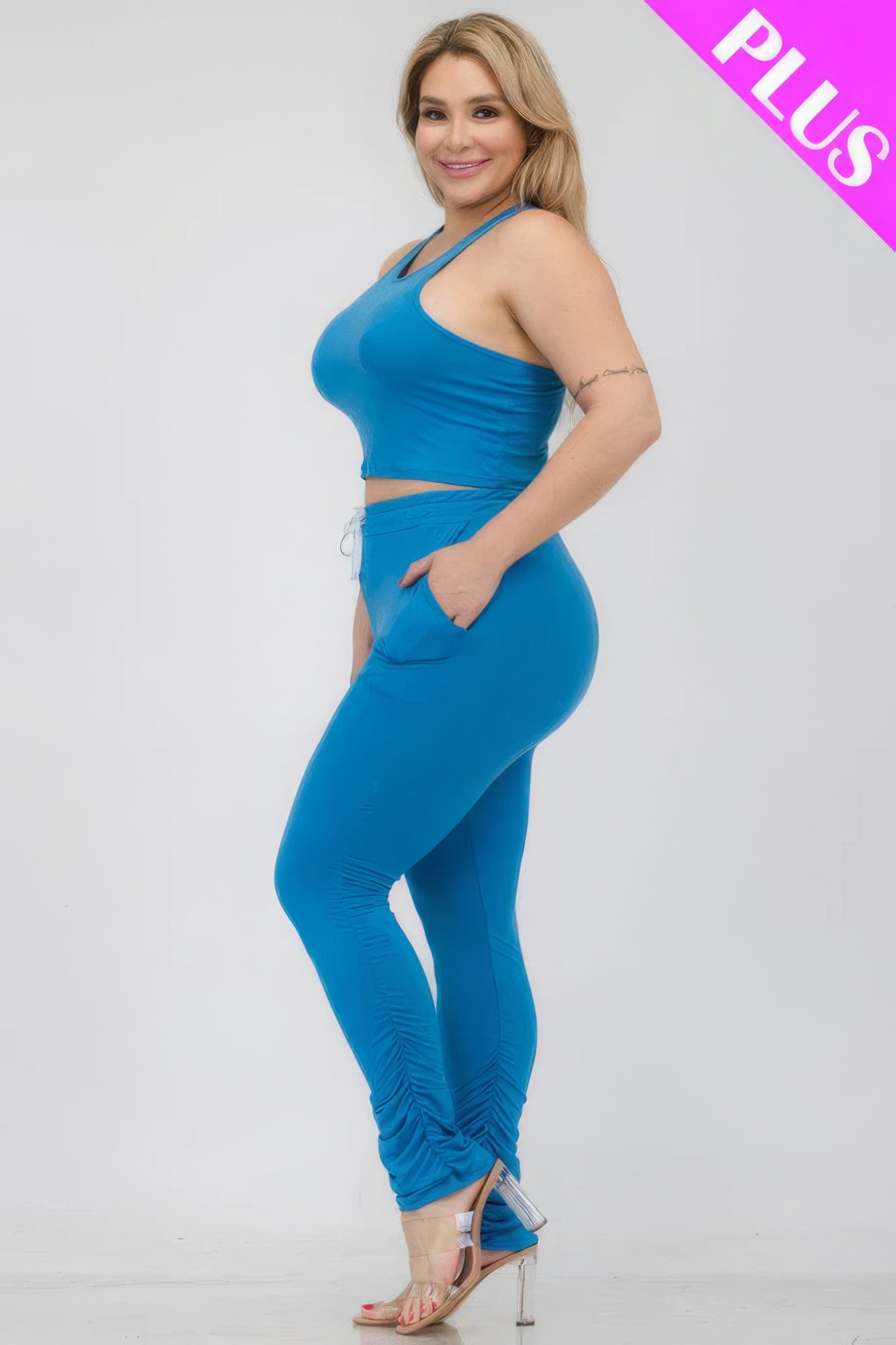 Plus size blue crop tank top and ruched pants set, featuring comfort and stretch, perfect for stylish everyday wear.