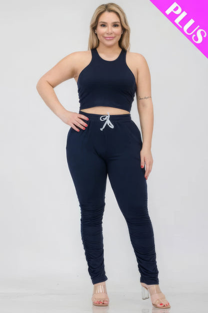 Plus size crop tank top and ruched pants set in navy, showcasing comfortable and stylish fit for a versatile wardrobe choice.