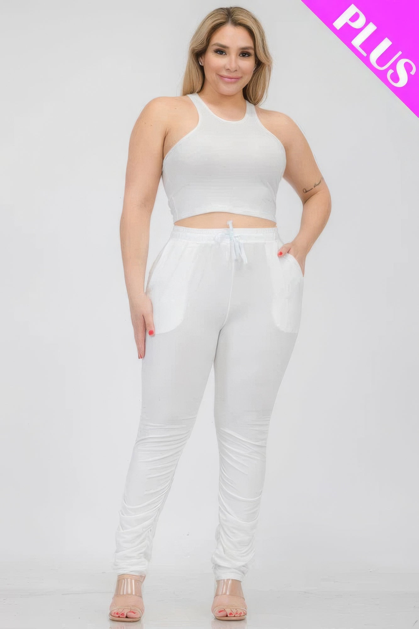 Plus size white crop tank top and ruched pants set, stylish and comfortable outfit made from polyester and spandex blend.