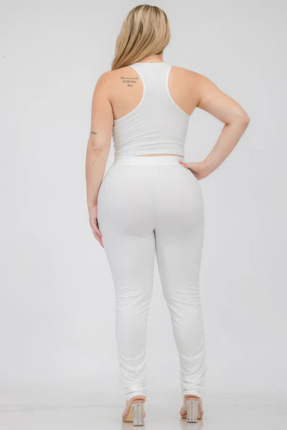 Plus Size Crop Tank Top & Ruched Pants Set in white, showcasing a stylish, stretchy fit from the back.