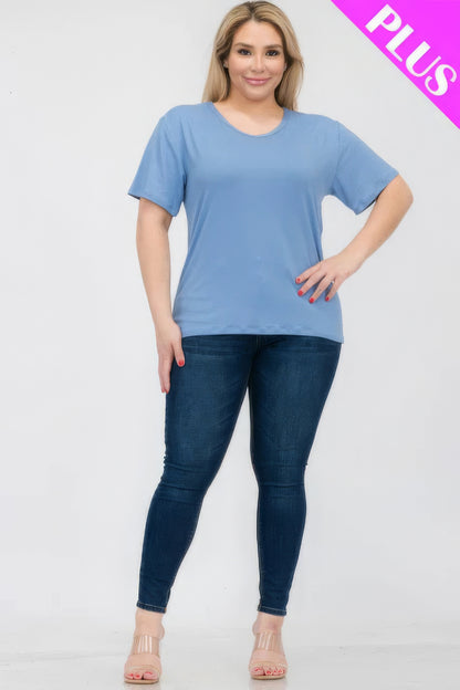 Plus size model wearing a comfortable light blue short sleeve t-shirt paired with dark denim, available at Loveitclothing.com.