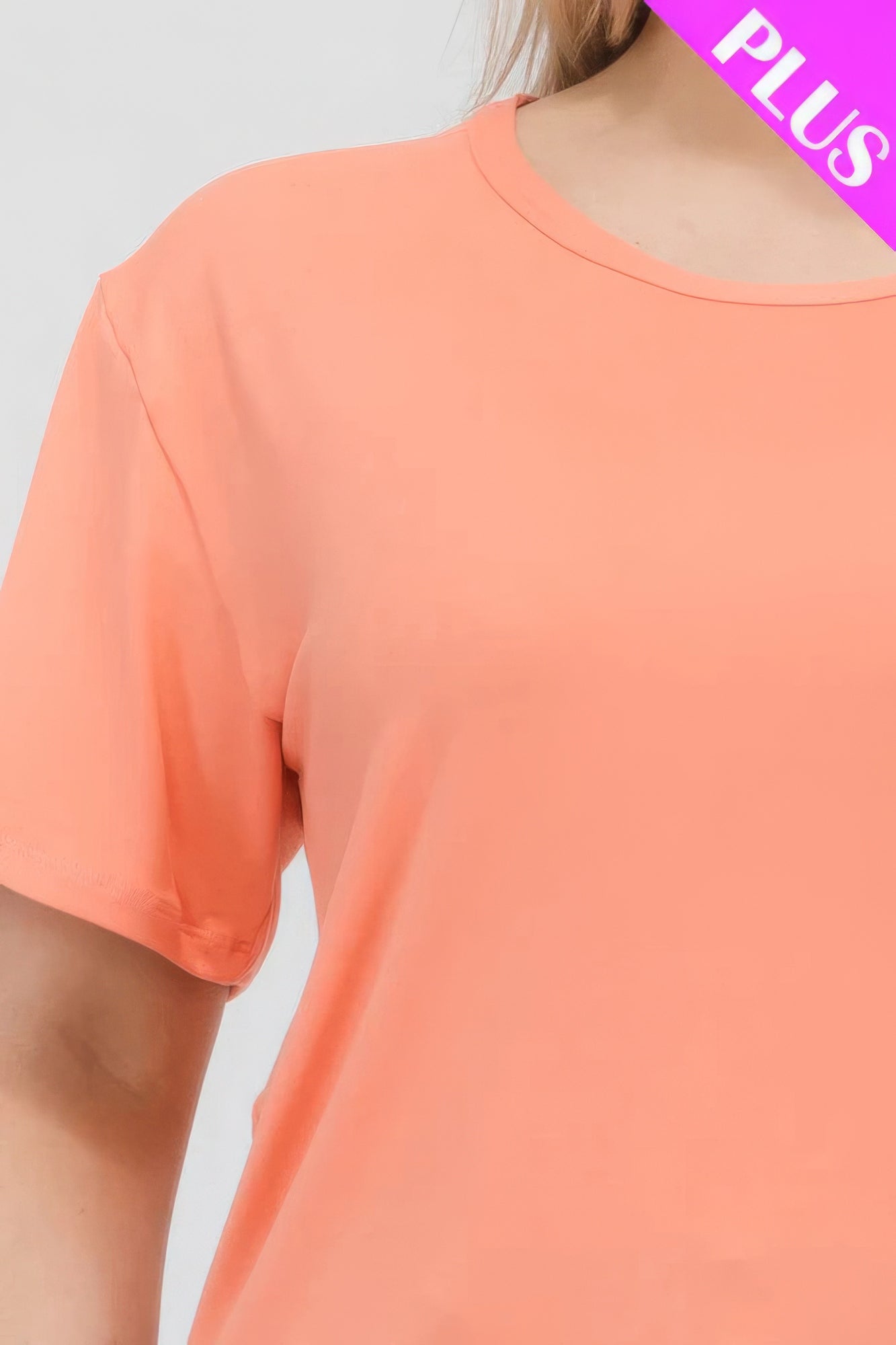 Plus size basic short sleeve T-shirt in coral, crafted for comfort with soft, stretchy fabric. Available at Loveitclothing.com.