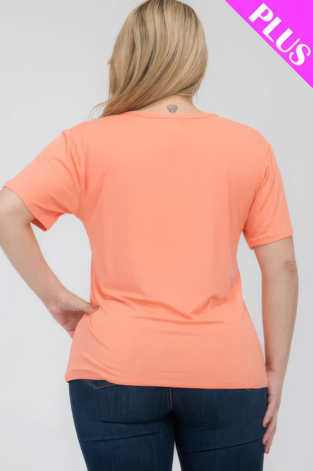 Plus size short sleeve t-shirt in coral, showcasing relaxed fit and soft fabric from Loveitclothing.com.