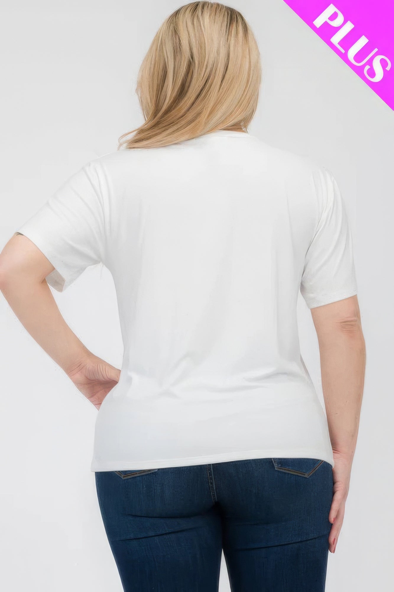 Back view of a woman wearing a plus size basic short sleeve T-shirt in white, showcasing its relaxed fit for comfort. Loveitclothing.com.