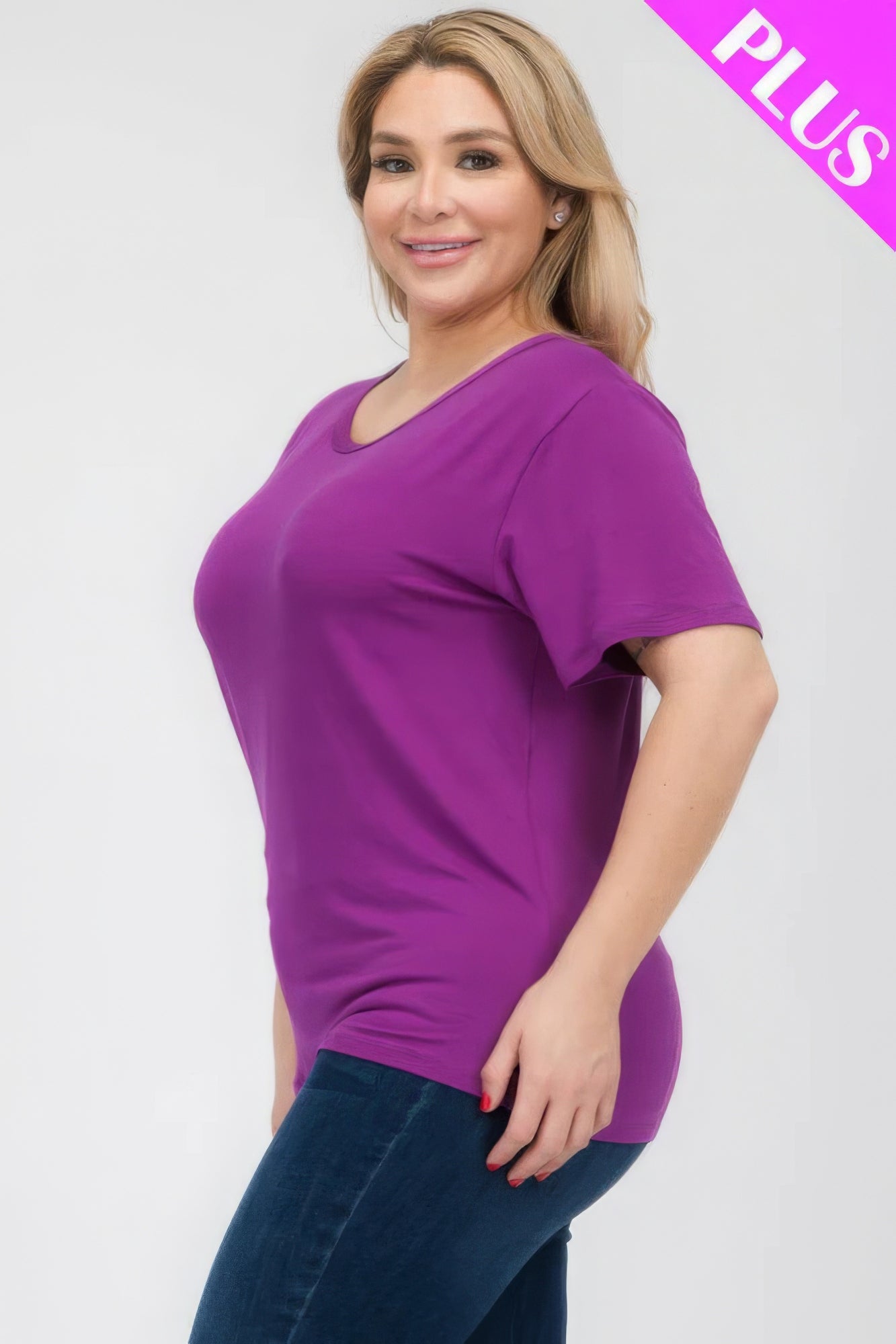 Plus size woman in a purple basic short sleeve T-shirt, showcasing comfort and style from Loveitclothing.com.