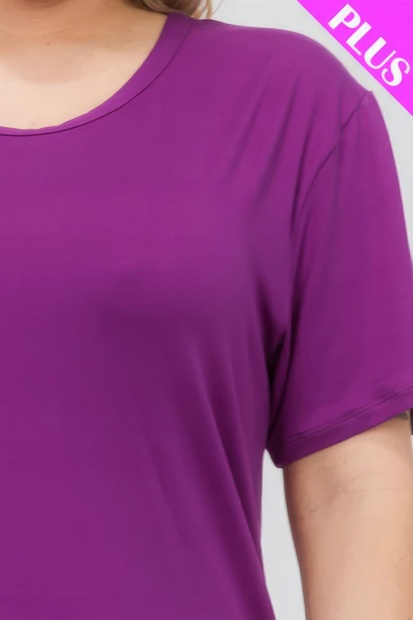 Plus size short sleeve t-shirt in vibrant purple, showcasing soft and stretchy fabric from Loveitclothing.com.