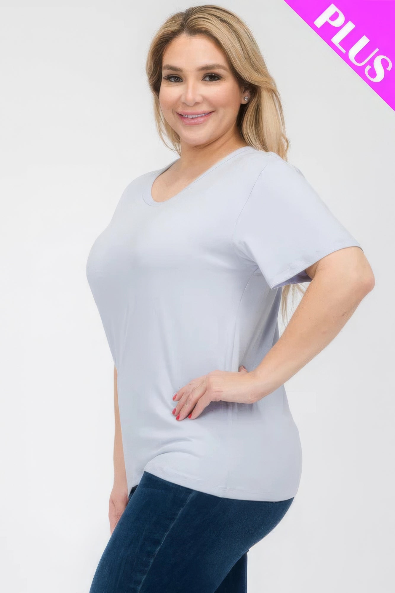 Plus size model wearing a light blue short sleeve T-shirt from Loveitclothing.com, showcasing a relaxed fit and modern style.