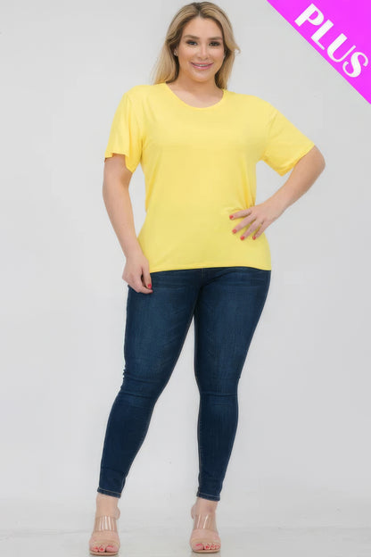 Plus size woman wearing a bright yellow short sleeve T-shirt paired with jeans, showcasing comfort and style from Loveitclothing.com.