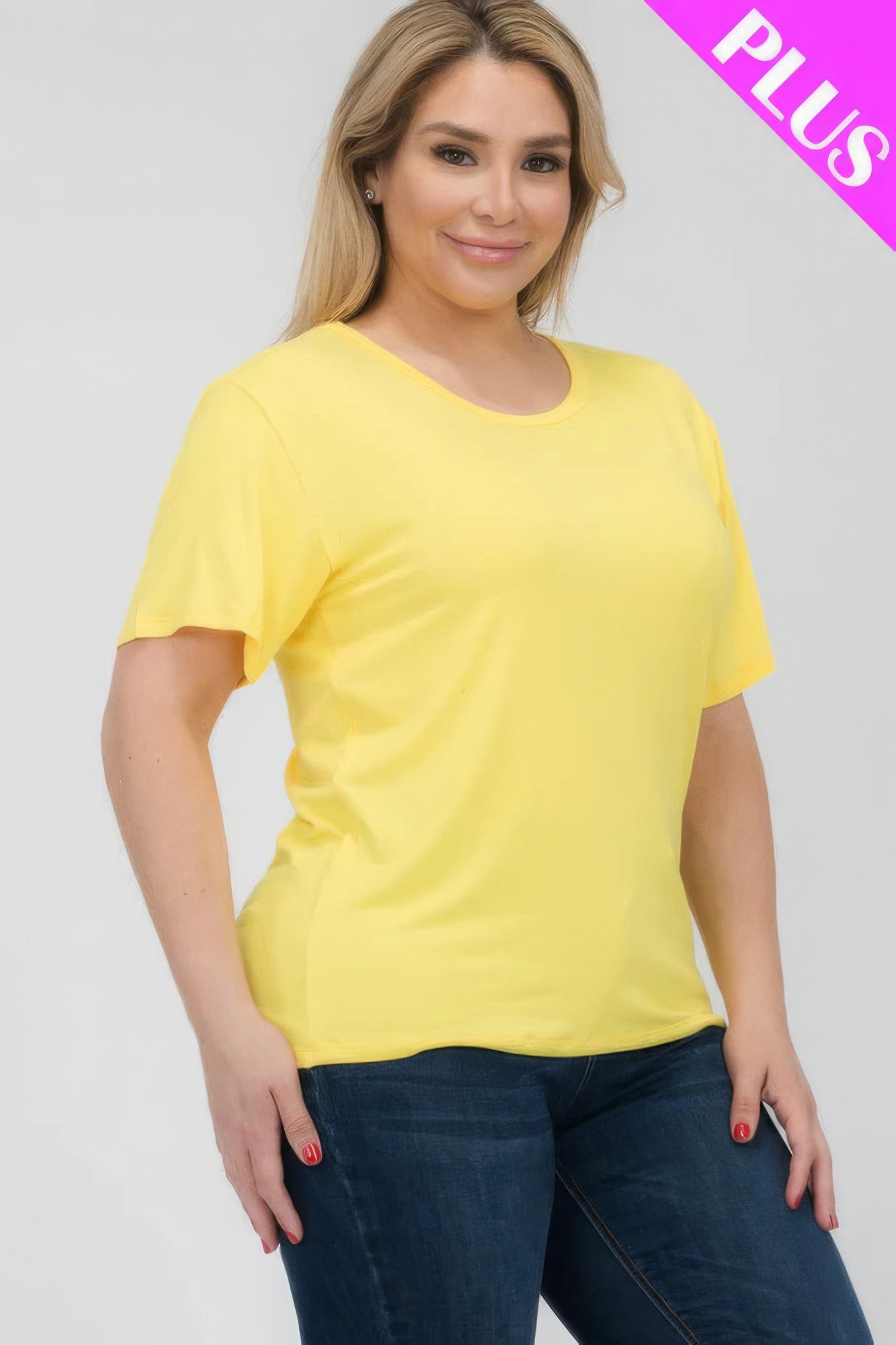 Plus size model wearing a yellow short sleeve T-shirt, showcasing comfort and style from Loveitclothing.com.