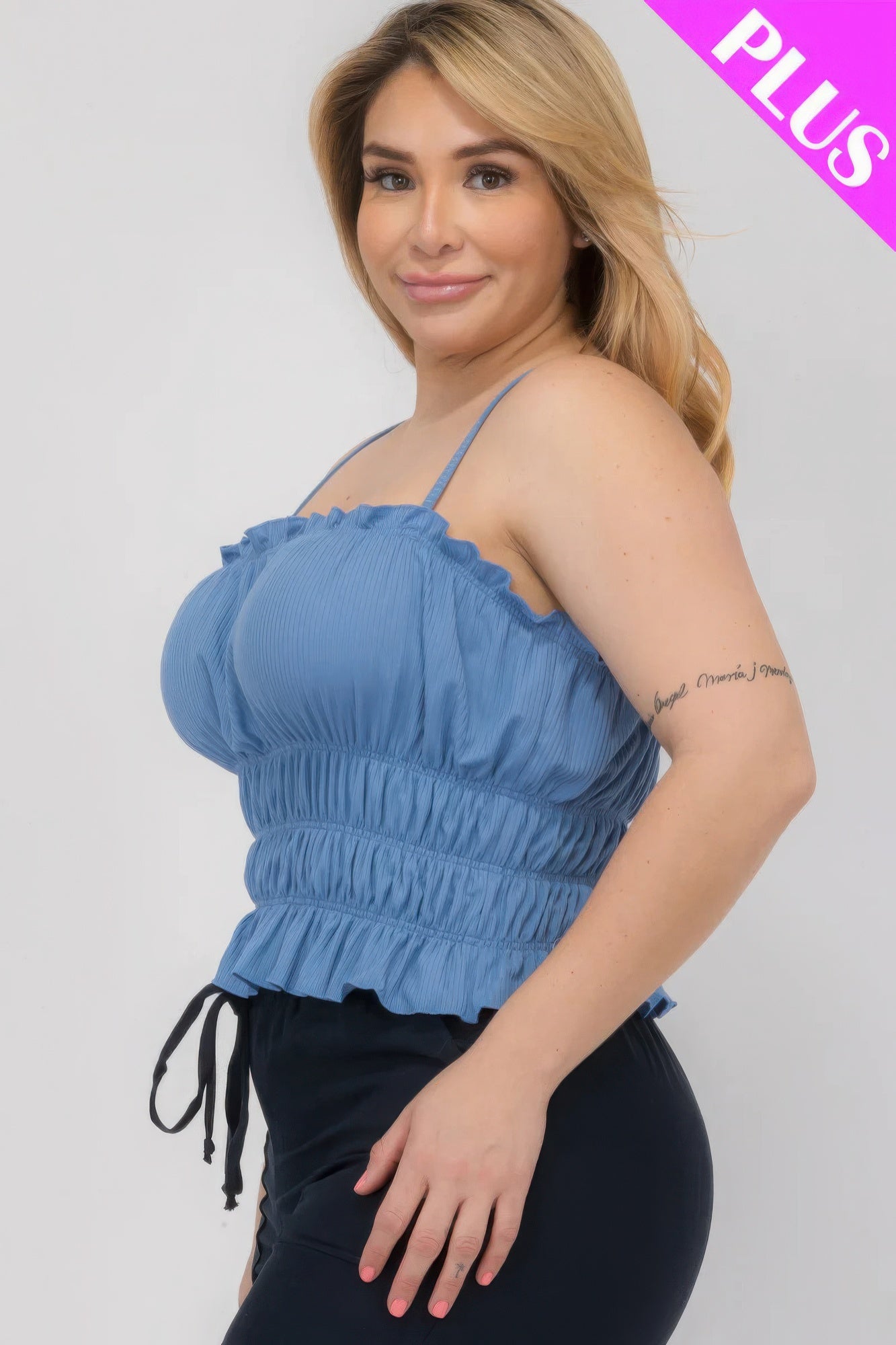 Plus size blue tiered shirred body crop top with spaghetti straps, featuring a flattering fit for curvy figures. Shop at Loveitclothing.com