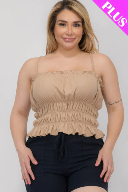 Plus size model in a tiered shirred body crop top, blush color, from Loveitclothing.com, stylish and curve-accentuating design.