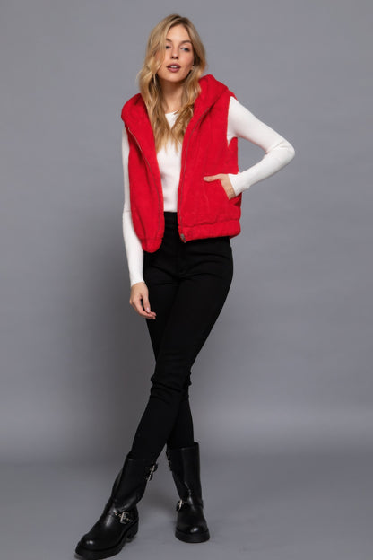 Red faux fur vest with hoodie by Love It Clothing, stylish layering piece perfect for adding warmth and luxury to any outfit.