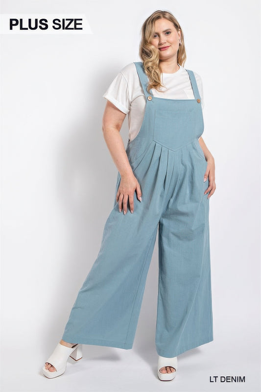 Plus size model in light denim pintuck detail overall with side pockets from Loveitclothing.com