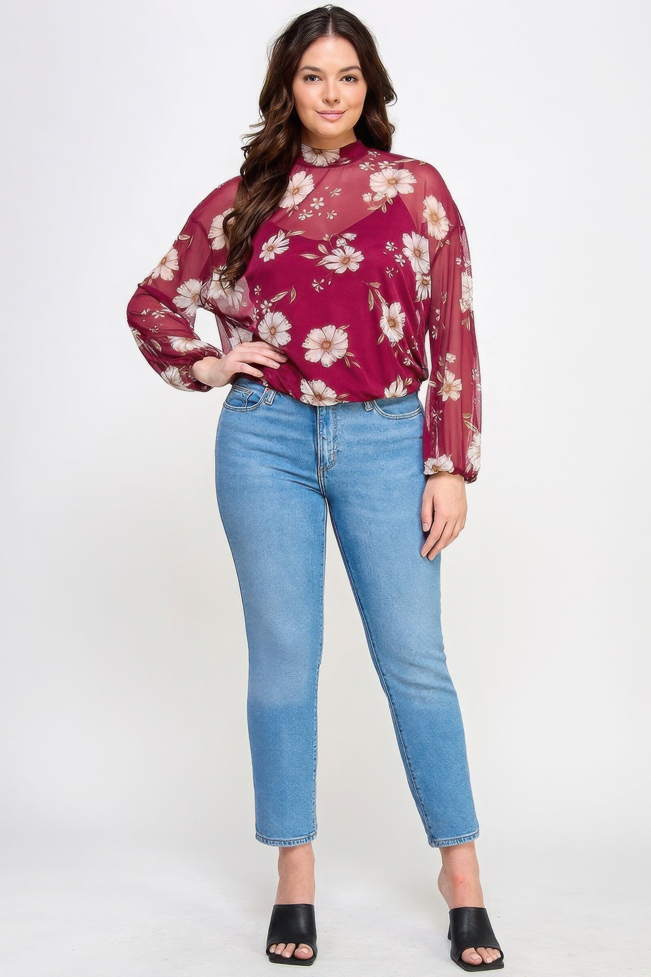 Woman wearing Mesh Floral Long Sleeve Top with Cami from Loveitclothing.com, paired with blue jeans.