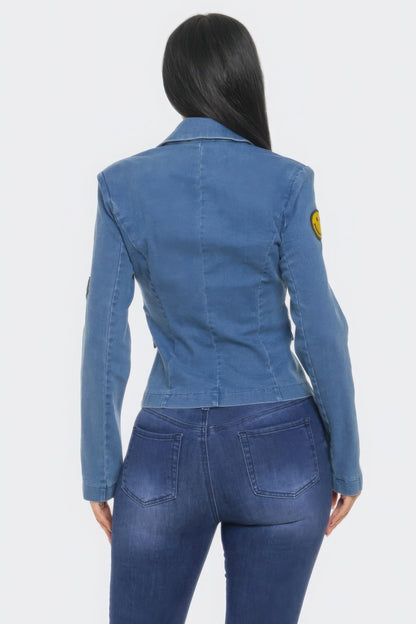 Woman wearing Patch It Up Denim Blazer Jacket with emoticon patches, showcasing trendy Love It Clothing brand style.