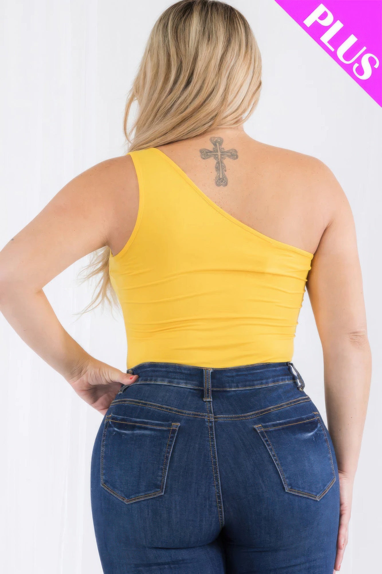 Plus size one shoulder yellow bodysuit showcasing a stylish back view, paired with denim jeans. Loveitclothing.com.