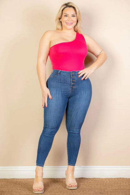 Plus size model wearing a one-shoulder pink bodysuit with high-waisted jeans from Loveitclothing.com.