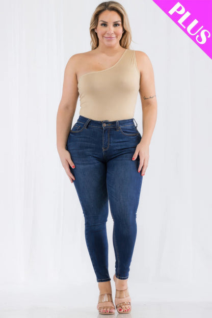 Plus size one shoulder bodysuit in beige paired with fitted jeans, showcasing modern casual style from Loveitclothing.com.