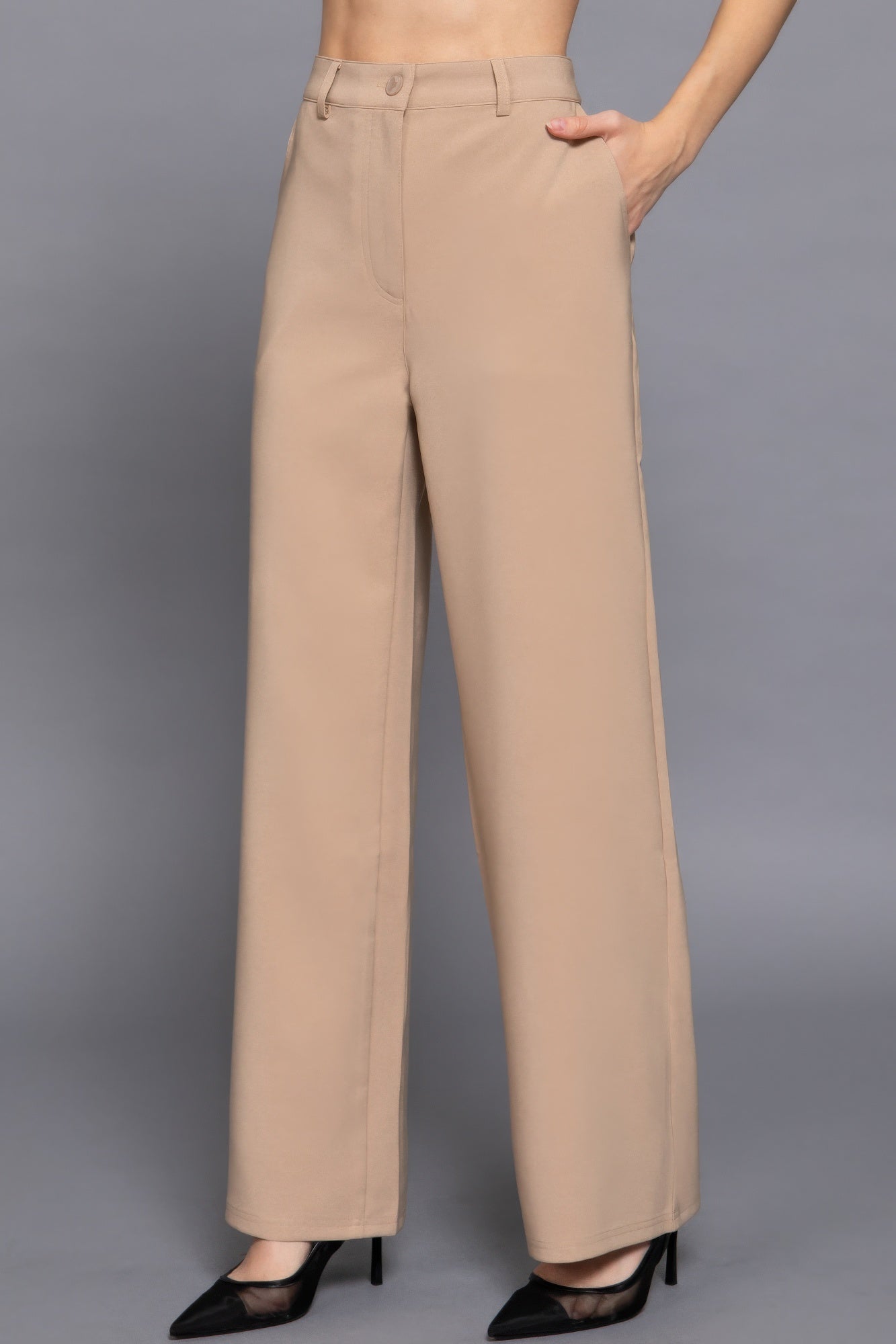 Back elastic straight woven long pants in beige displayed on a model, showcasing a chic and sophisticated look.