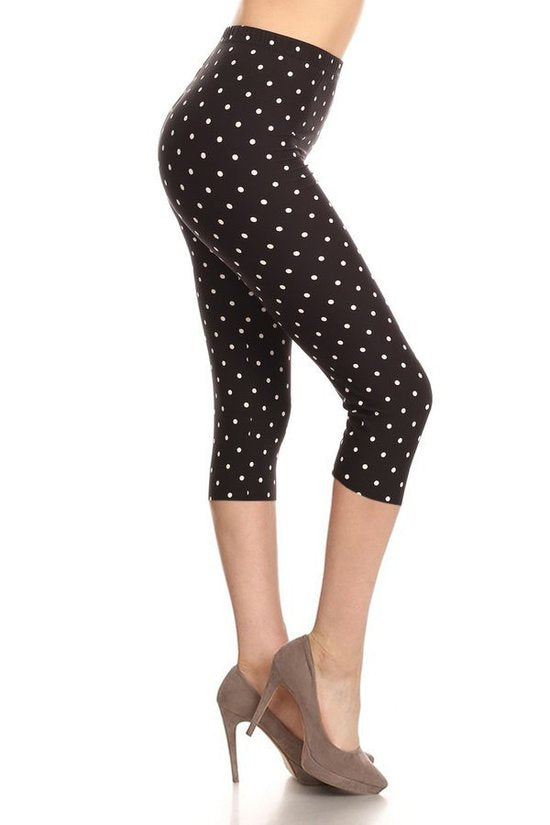 High Waisted Capri Leggings With An Elastic Band In A White Polka Dot Print Over A Black Background - Love It Clothing